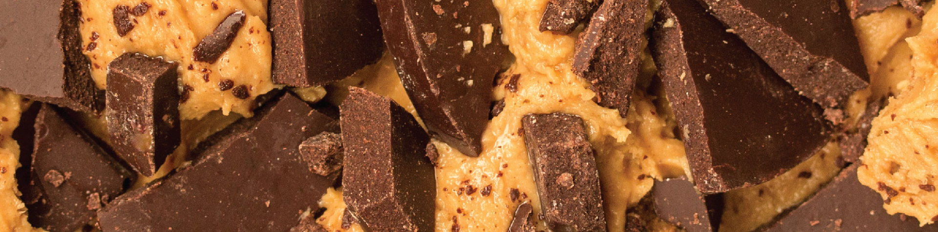 chunks of chocolate in creamy peanut butter